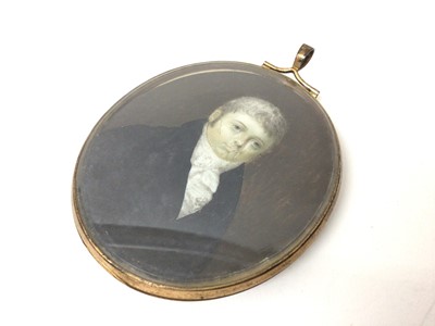 Lot 100 - Georgian portrait miniature of a gentleman, painted on ivory, in brass frame