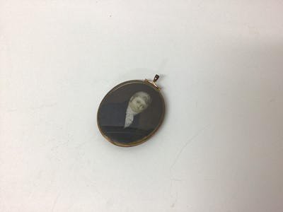 Lot 100 - Georgian portrait miniature of a gentleman, painted on ivory, in brass frame