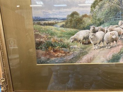 Lot 141 - A Watts (early 20th century) watercolour, Sheep in a lane, signed and dated 1911, glazed gilt frame