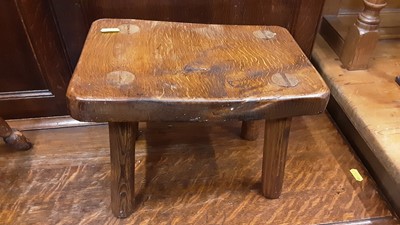 Lot 928 - Two antique milking stools together with a brass-bound oak planter