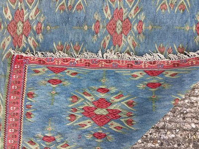 Lot 1450 - Kelim rug on blue ground 130cm x 200cm