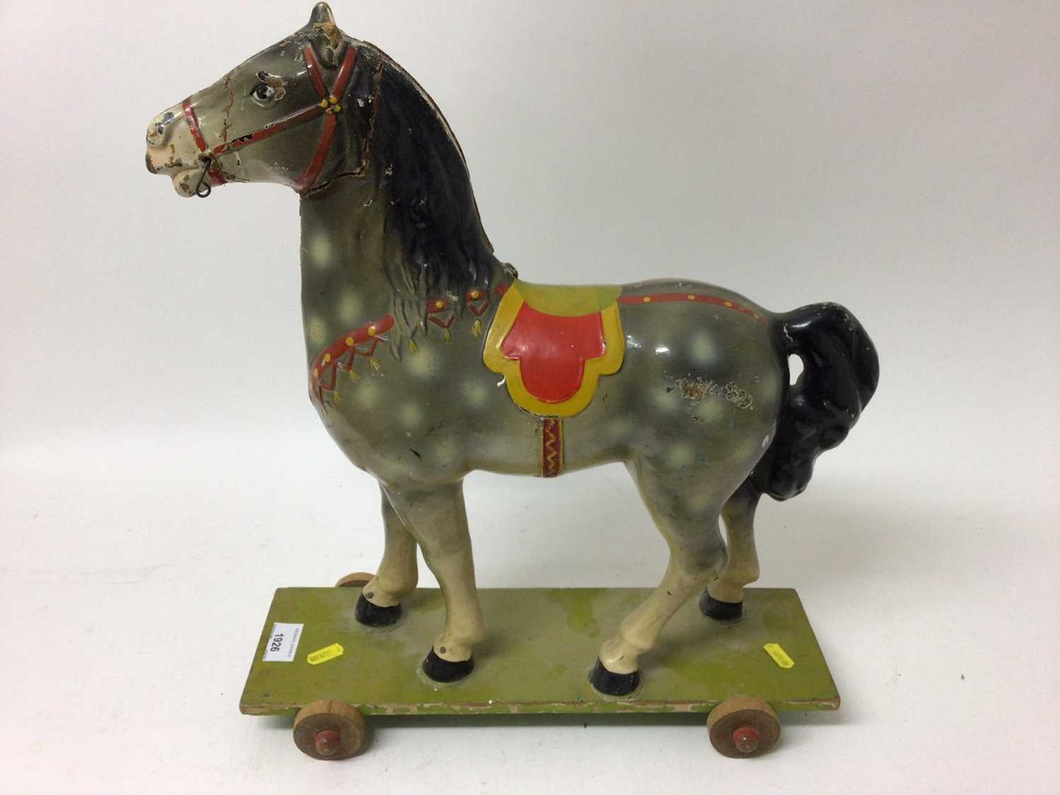 Lot 1926 - old painted child's horse on wheels