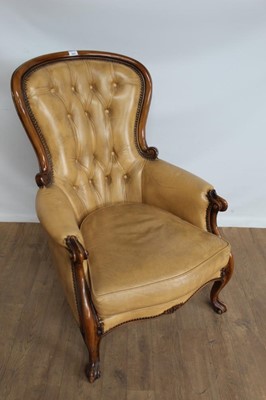 Lot 1002 - Victorian-style buttoned leather upholstered armchair on carved scroll supports