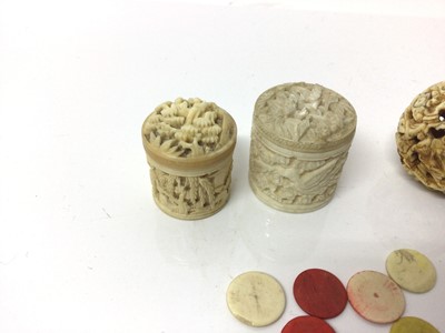 Lot 34 - Three 19th century Chinese carved ivory boxes, together with an ivory ball carved with dragons and a small quantity of counters
