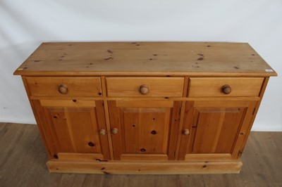 Lot 1014 - Modern pine sideboard with three drawers above three cupboard doors below