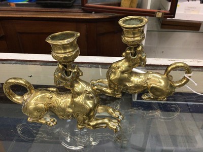 Lot 323 - Pair Victorian brass novelty candlesticks with griffin supports