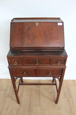 Lot 1017 - 19th century-style miniature mahogany writing desk with fall front enclosing fitted interior, above an arrangement of five drawers