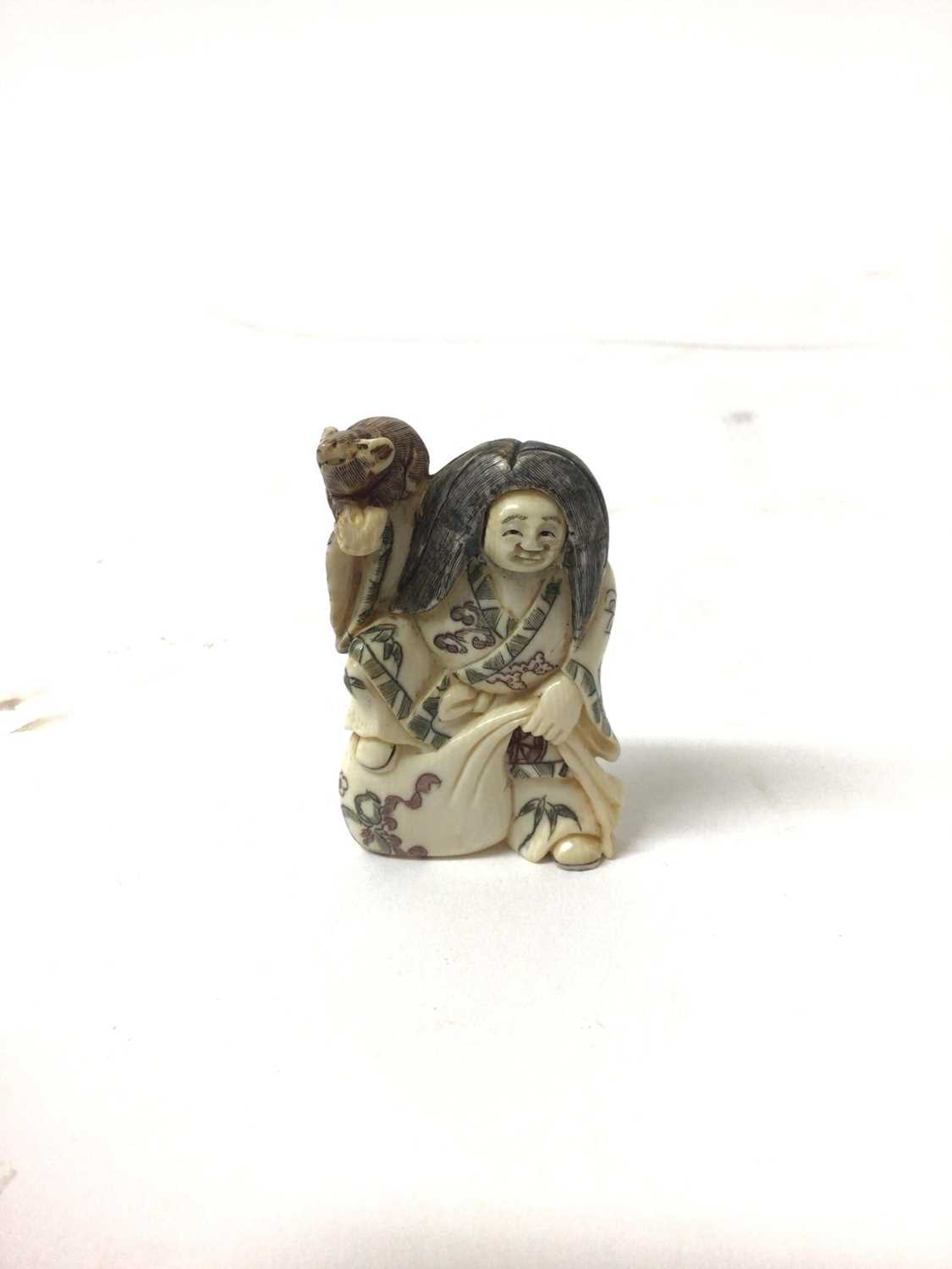 Lot 38 - 19th century Japanese cared ivory netsuke of a Noh theatre figure with revolving head, 5.5cm high