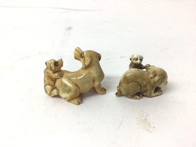 Lot 40 - Two 19th century Japanese ivory 'dog and puppy' netsuke
