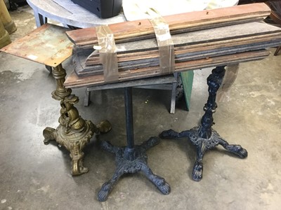 Lot 1092 - Three antique cast iron pub tables, one with a wooden top (3)