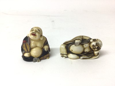 Lot 42 - Two 19th century Japanese carved figures of Buddha, one a netsuke and shown reclining, the other painted and seated