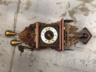 Lot 529 - A wooden cased wall clock with weights on chains