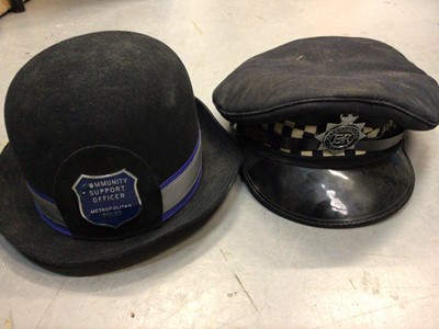 Lot 418 - Two boxes of sundries to include Police hats, books, phone cards and sundries