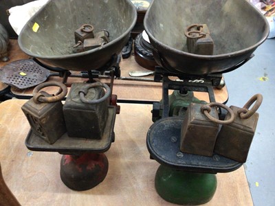 Lot 413 - Two sets of vintage shop scales together with a carved wooden mantel clock (3)