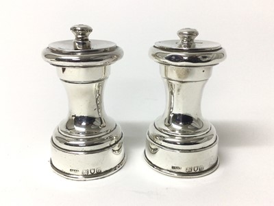 Lot 195 - Pair of late Victorian silver pepper mills, hallmarked London 1899 maker John Grinsell & Sons