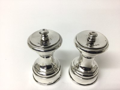 Lot 195 - Pair of late Victorian silver pepper mills, hallmarked London 1899 maker John Grinsell & Sons