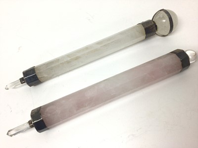 Lot 57 - Rose quartz chakra/healing wand and one other quartz wand, both with white metal mounts