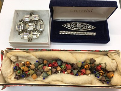 Lot 673 - Three vintage paste brooches and an Art Deco/1930s wooden bead necklace