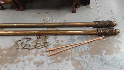 Lot 49 - Pair of brass curtain poles complete with rings 96"