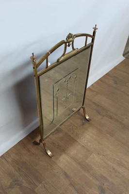 Lot 1053 - Brass and mirrored fire guard