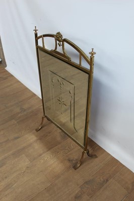 Lot 1053 - Brass and mirrored fire guard