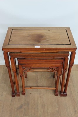 Lot 1041 - Nest of three Chinese hardwood side tables