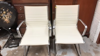 Lot 1004 - Set of four Eames style white leather-type upholstery and chrome cantilever dining chairs