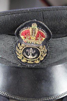 Lot 749 - Second World War period Royal Navy cap by Sanders & Brightman together with two Navy veterans jackets with mounted medal ribbons and navy buttons.