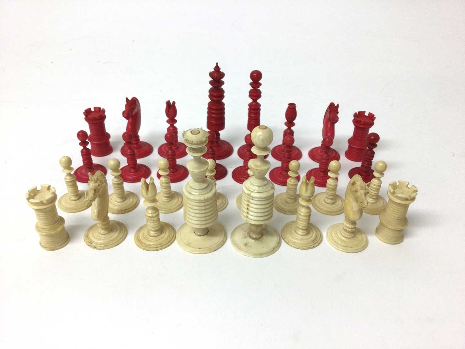 Lot 96 - Complete set of 19th century bone and red stained ivory chess pieces