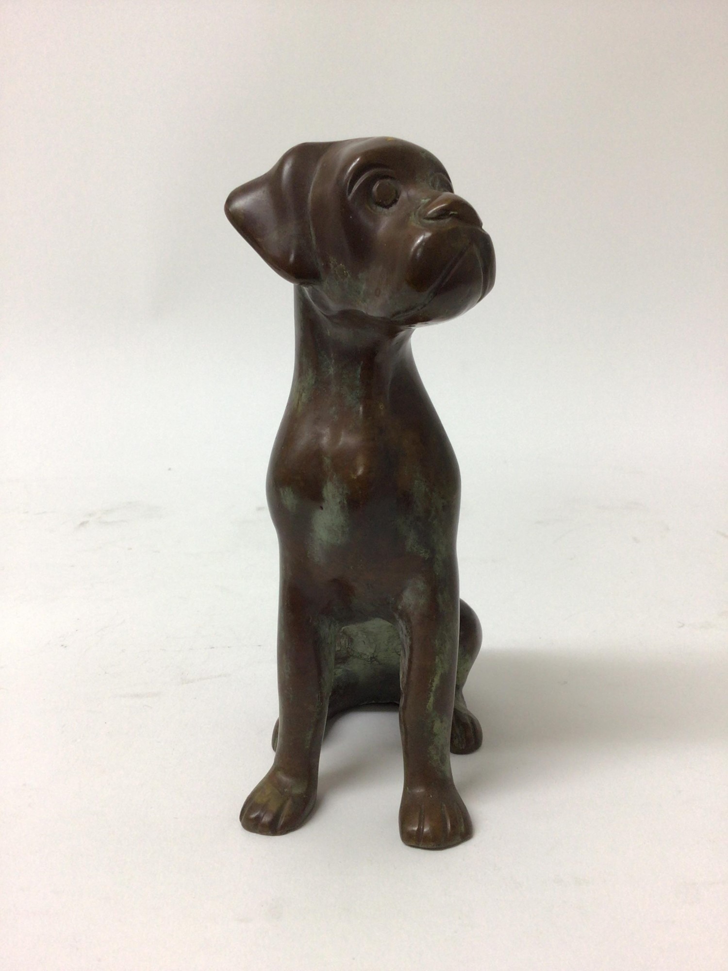 Lot 105 Bronze sculpture of a seated dog, 17.5cm