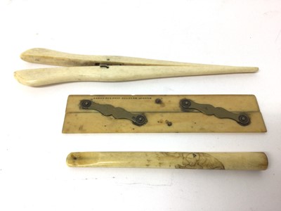Lot 107 - Pair of ivory glove stretchers, an ivory parallel rule, and a Japanese ivory cheroot holder carved with a tiger (3)