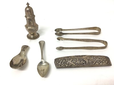 Lot 108 - Group of silver, including continental caddy spoon and comb, a teaspoon, two sugar nips, and a caster