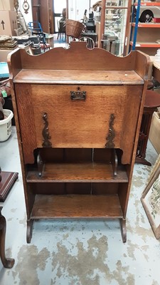 Lot 870 - Edwardian oak escritoire with fall front and open shelves below, 64.5cm wide, 24cm deep, 119cm high