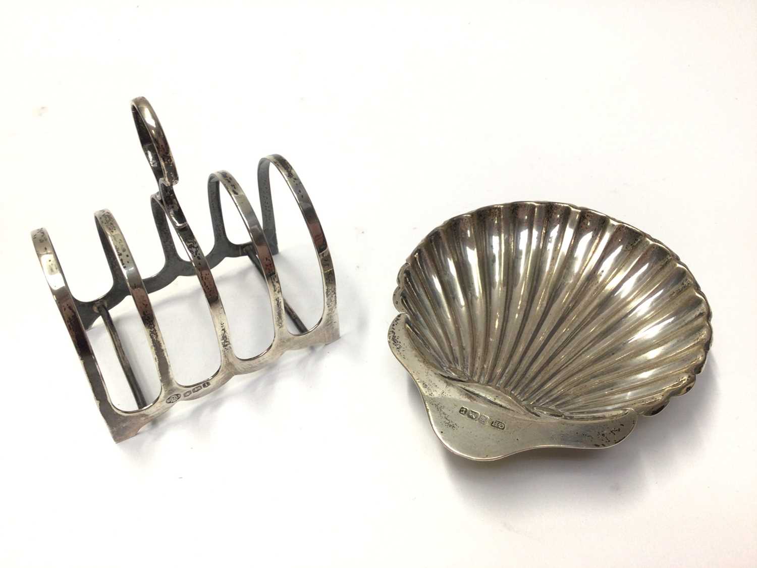 Lot 68 - Silver toast rack together with a silver shell butter dish