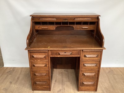 Lot 876 - Early 20th century oak roll top desk with tambour shutter and seven drawers below, 106cm wide, 68cm deep, 114cm high