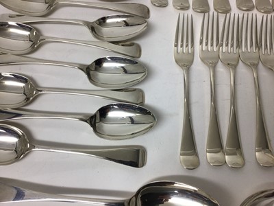 Lot 117 - Quantity of silver flatware, including twenty-four matching forks (twelve dessert and twelve dinner), twelve dessert spoons, and two table spoons (38 pieces)