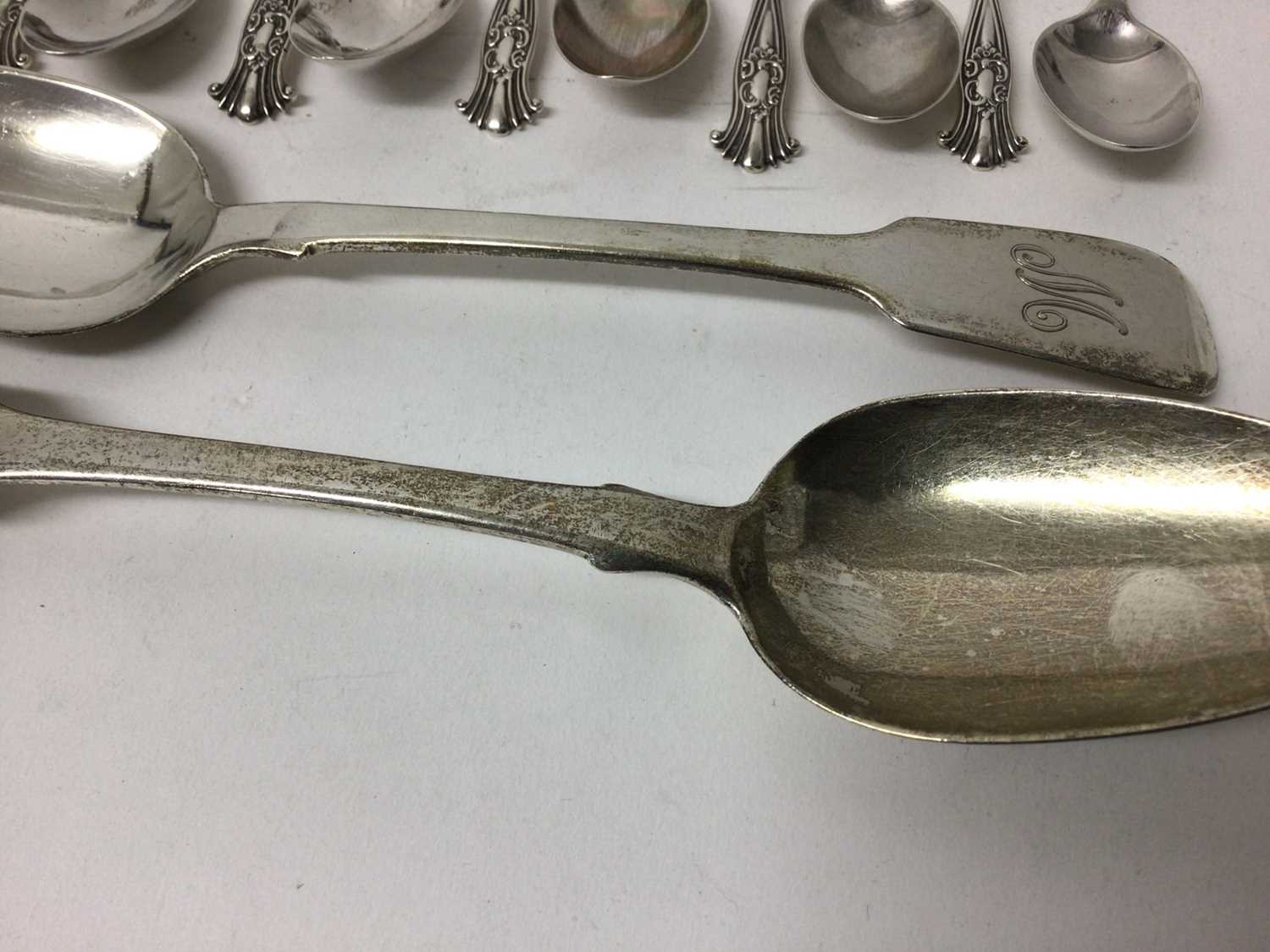 Lot 120 - Pair of Georgian silver tablespoons, together with a set of eleven silver teaspoons, another set of six, and two other silver spoons