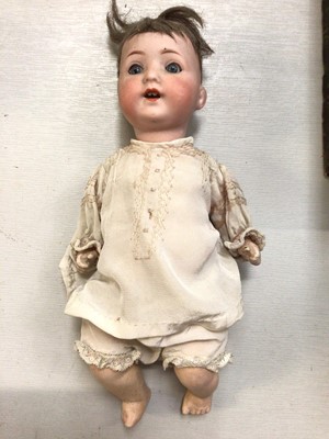 Lot 262 - Armand Marseille doll with bisque head marked Germany 995 A. 810. M, composite body and limbs within a vintage doll's pram