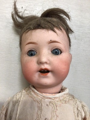 Lot 262 - Armand Marseille doll with bisque head marked Germany 995 A. 810. M, composite body and limbs within a vintage doll's pram