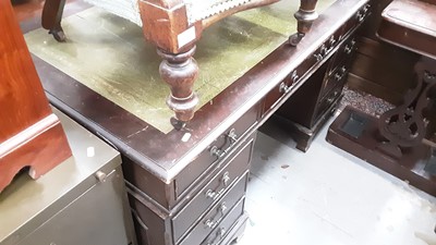 Lot 904 - Reproduction mahogany twin pedestal desk with inset leather lined top and eight drawers below, 136cm wide, 75cm deep, 78cm high