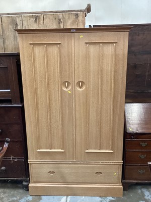 Lot 913 - Contemporary limed oak double wardrobe with single drawer below, 109cm, 62cm deep, 179.5cm high