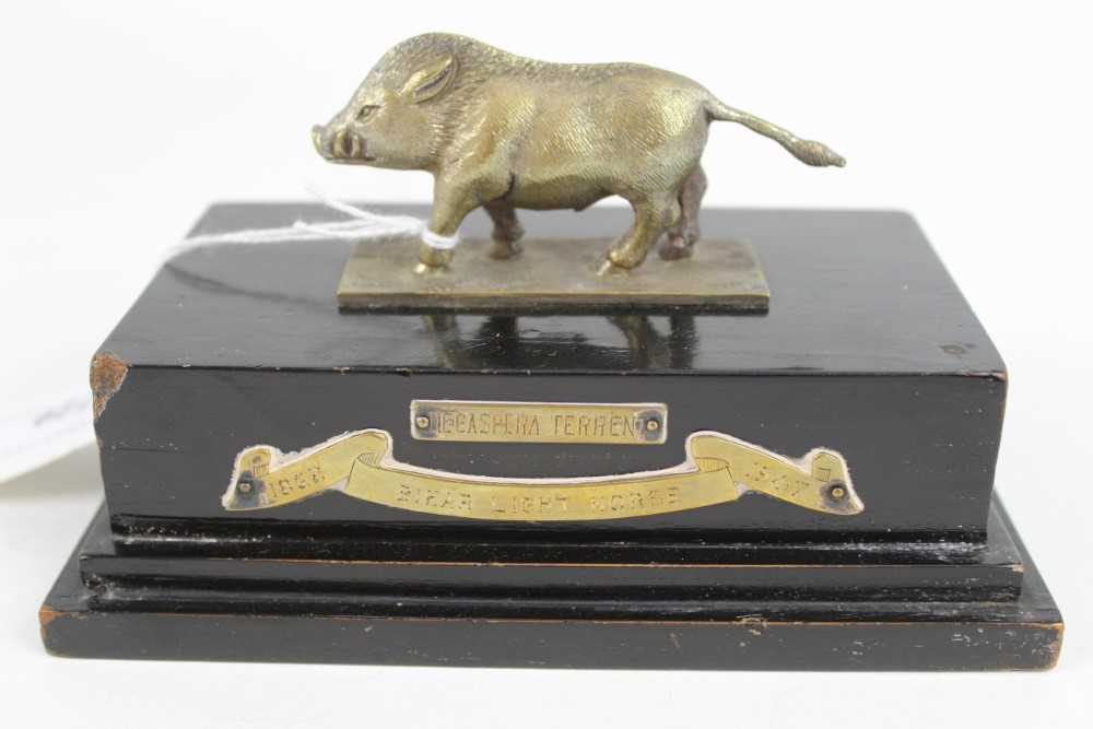 Lot 729 - 1940's Indian Army trophy depicting a Boar mounted on an ebonised wood base with applied plaques