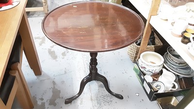 Lot 929 - Nineteenth century mahogany wine table with circular tilt top on turned column and tripod base, 64cm diameter