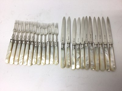 Lot 127 - Two near sets of Edwardian silver and mother of pearl cutlery, including twelve knives and twelve forks