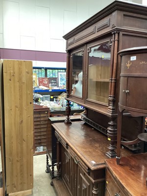 Lot 938 - Late nineteenth century continental oak two height bookcase/cabinet with two glazed doors above raised on turned front supports, two drawers and two panelled doors below, 137cm wide, 55cm deep, 225...