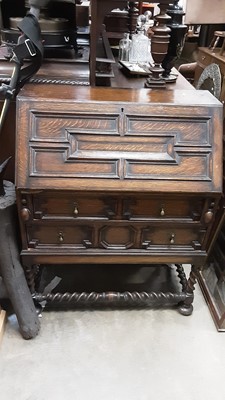 Lot 940 - 1930s oak bureau with geometric decoration and two drawers below on spiral twist supports, 81.5cm wide, 44cm deep, 102cm high