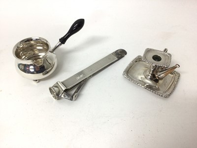 Lot 130 - Georgian silver chamberstick, Sheffield 1817, with associated silver plated snuffer, together with a silver cigar cutter and silver brandy warmer