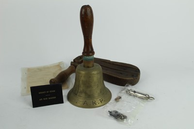 Lot 732 - Second World War ARP Air Raid Wardens bell, together with a gas rattle, county of Essex, wardens pass, whistle, badges and form.