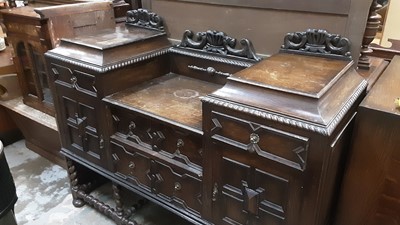 Lot 942 - 1930s oak sunk centre sideboard with geometric decoration, with four drawers and two panelled doors on spiral twist supports, 152cm wide, 55cm deep, 112cm high