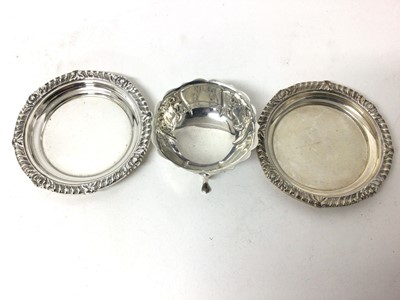 Lot 133 - Heavy pair of Goldsmiths & Silversmiths silver dishes with reeded borders, London 1937, together with a Goldsmiths & Silversmiths tripod bowl with relief moulded floral decoration and scalloped rim...